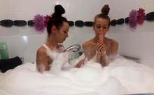 Hotties playing with each other in bath tub