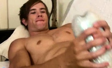 Sexy gay boy filmed close-up while testing his new toy