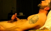 Hairy bear jacking on bed