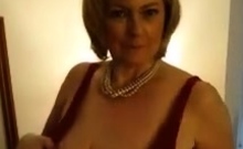 Blonde mature Bridget with big boobs posing